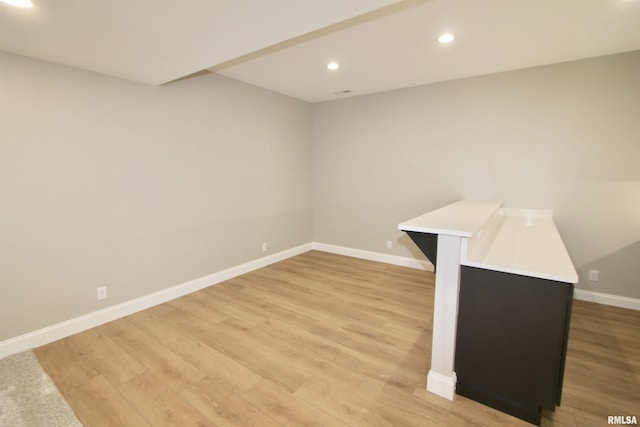 spare room featuring light hardwood / wood-style flooring