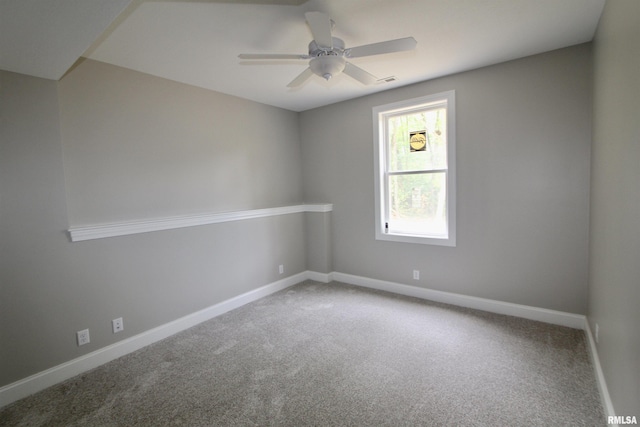 spare room featuring carpet flooring and ceiling fan