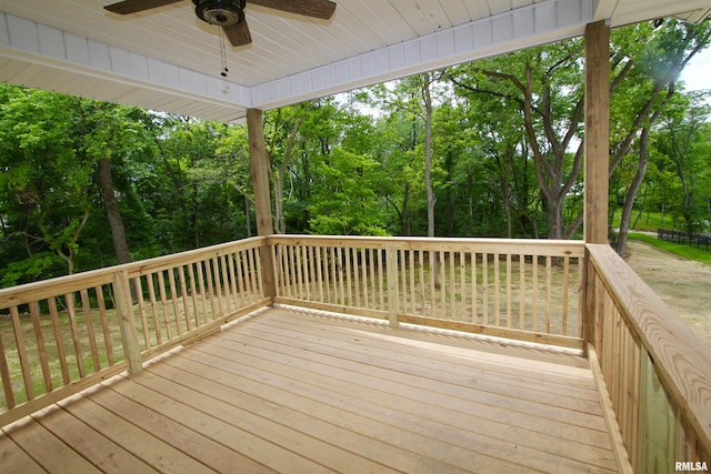 wooden deck featuring ceiling fan