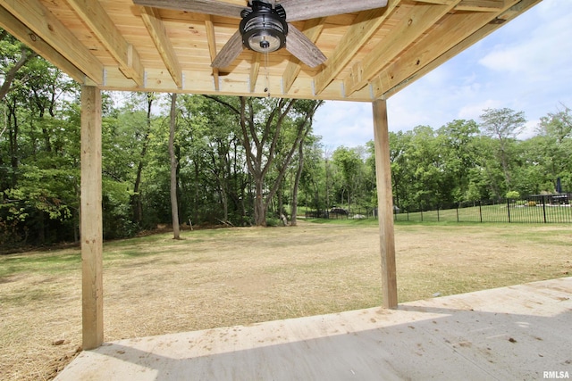 view of yard featuring ceiling fan and a patio