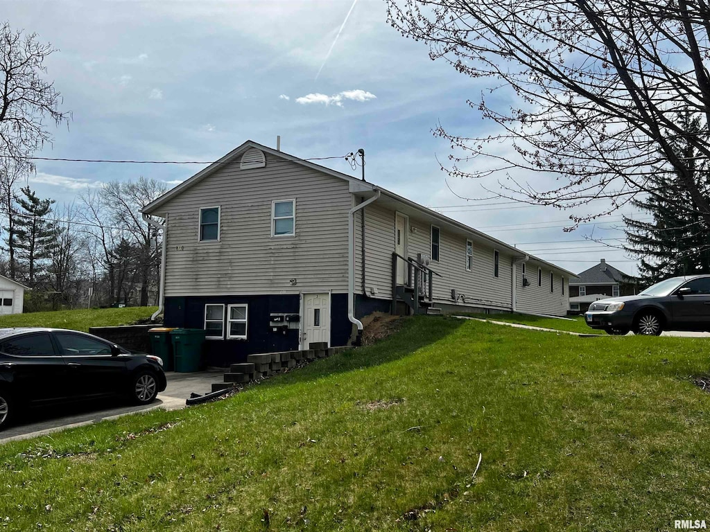 view of home's exterior featuring a lawn