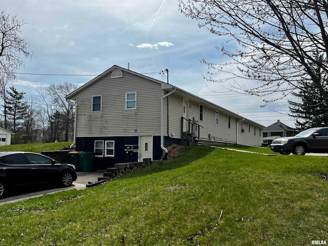 view of home's exterior featuring a lawn