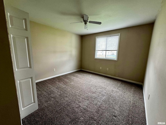 unfurnished room featuring dark colored carpet and ceiling fan