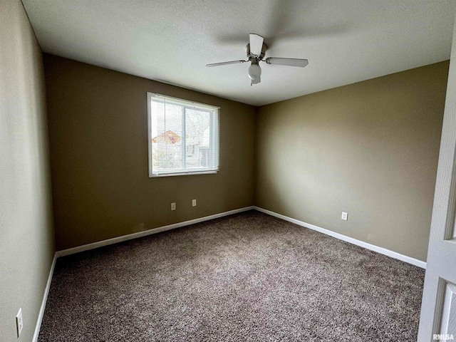 carpeted empty room featuring ceiling fan and a textured ceiling