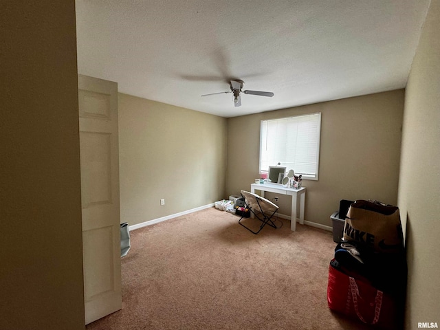 misc room featuring carpet flooring, ceiling fan, and a textured ceiling