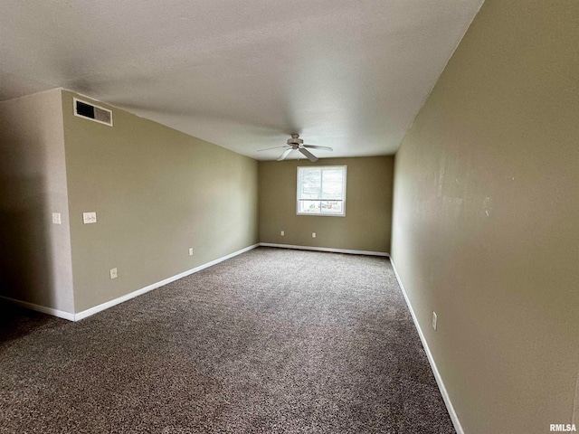 spare room featuring a textured ceiling, ceiling fan, and carpet floors