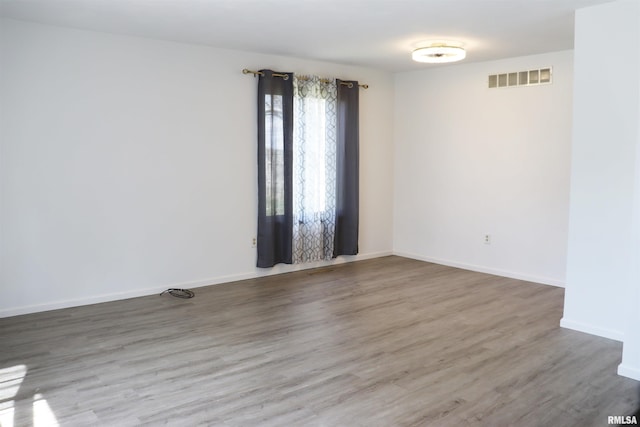 unfurnished room with a healthy amount of sunlight and carpet flooring