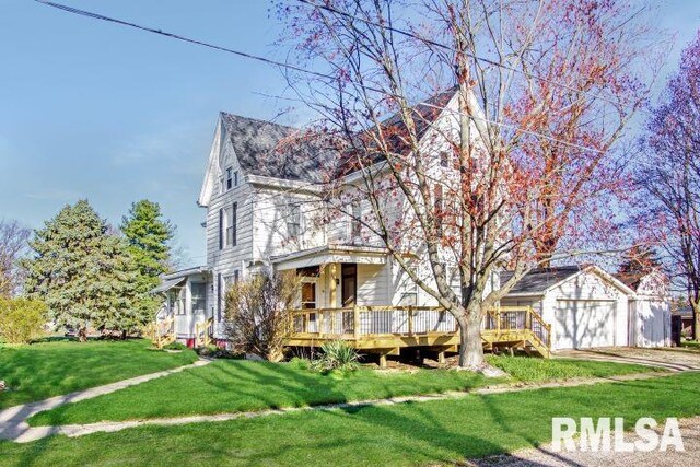 view of front of home with a front lawn and a deck