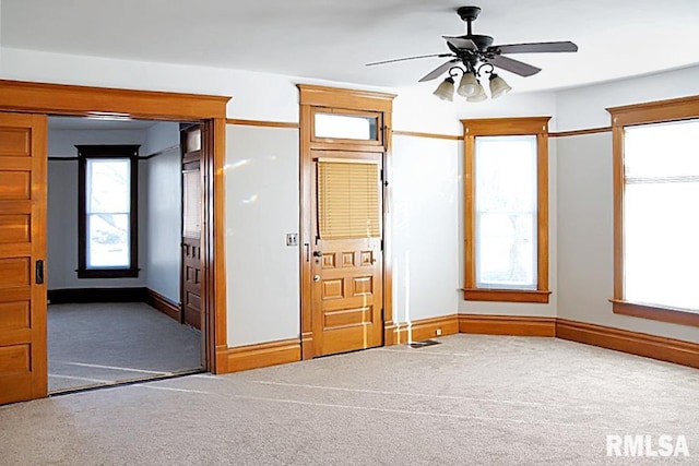 unfurnished bedroom with ceiling fan and carpet flooring