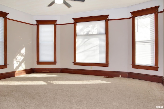 carpeted empty room with ceiling fan