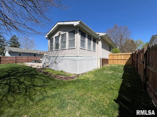 view of home's exterior with a lawn