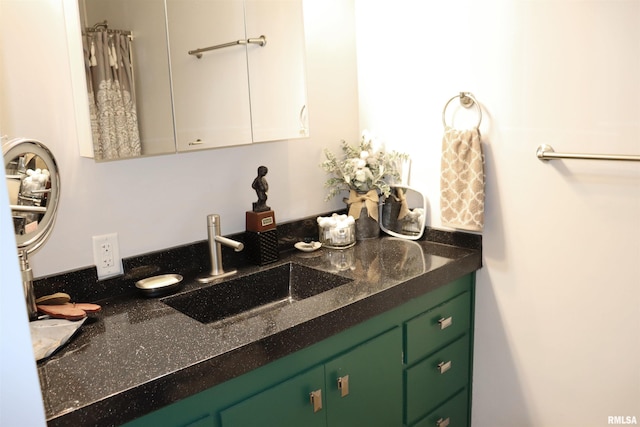 bathroom featuring vanity with extensive cabinet space