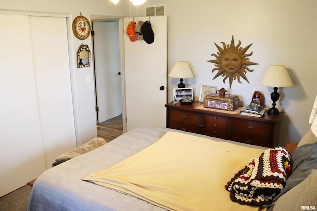 carpeted bedroom featuring a closet