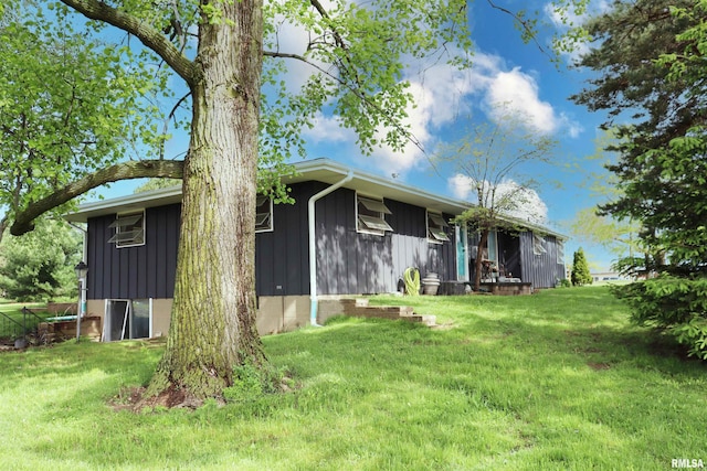 view of home's exterior with a yard