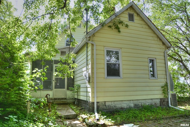 view of side of property with a sunroom