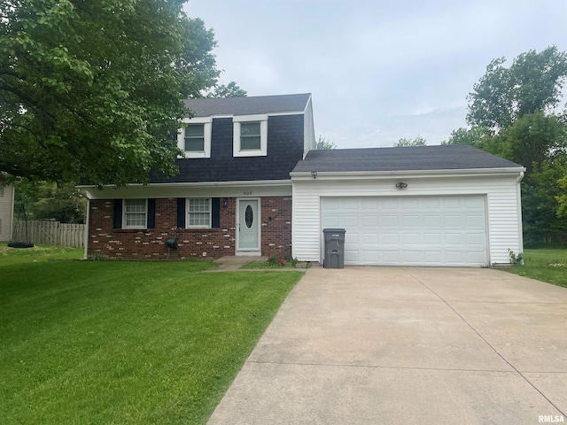 view of front facade with a garage and a front yard