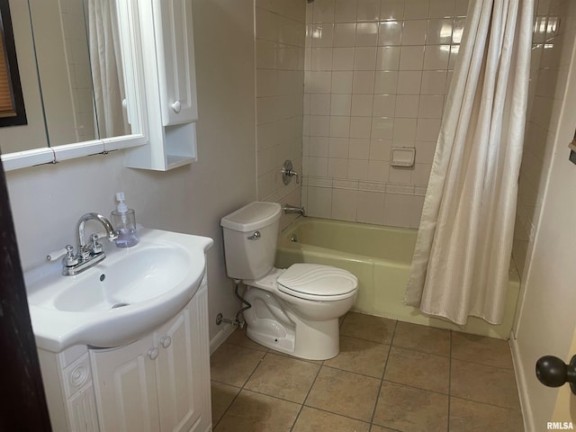 full bathroom with tile floors, shower / tub combo, toilet, and vanity