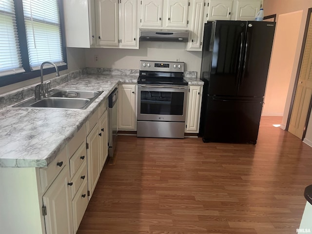 kitchen with dark hardwood / wood-style floors, sink, white cabinetry, and appliances with stainless steel finishes