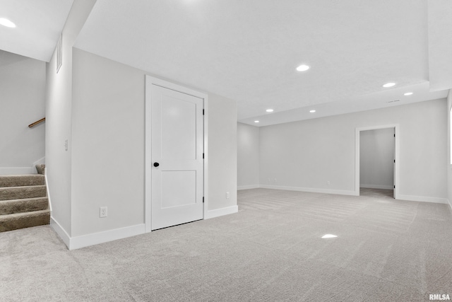 basement with light colored carpet