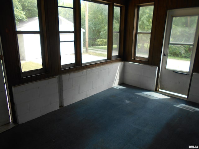 unfurnished sunroom with plenty of natural light