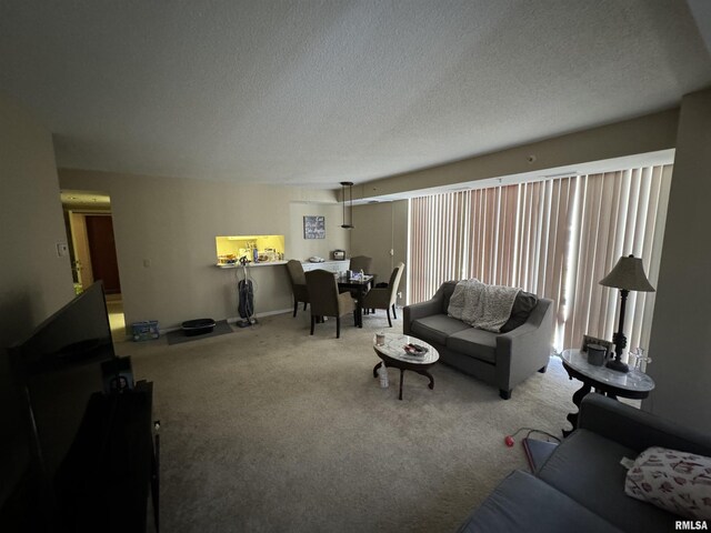 carpeted living room featuring a textured ceiling