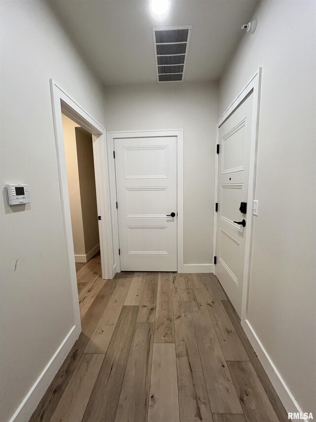 hallway featuring light hardwood / wood-style floors