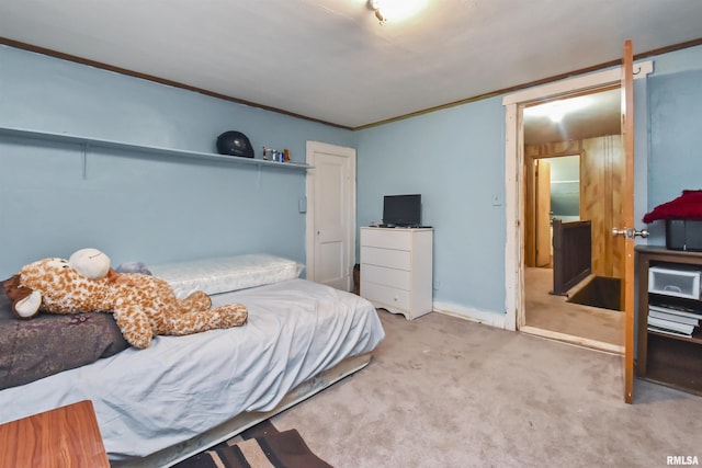 bedroom featuring light colored carpet and crown molding