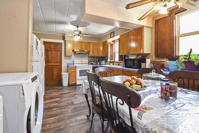 kitchen with ceiling fan, sink, dark wood-type flooring, white electric range, and separate washer and dryer