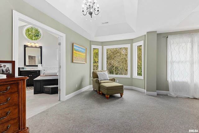 sitting room featuring a tray ceiling, visible vents, light carpet, baseboards, and a notable chandelier