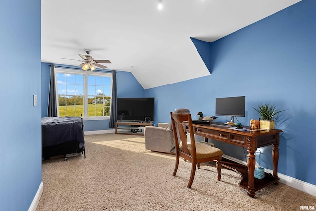 office space featuring lofted ceiling, carpet flooring, baseboards, and ceiling fan