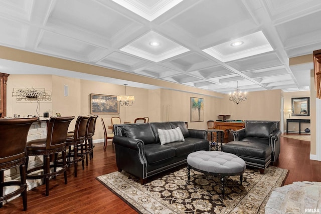 living area featuring baseboards, a notable chandelier, and coffered ceiling
