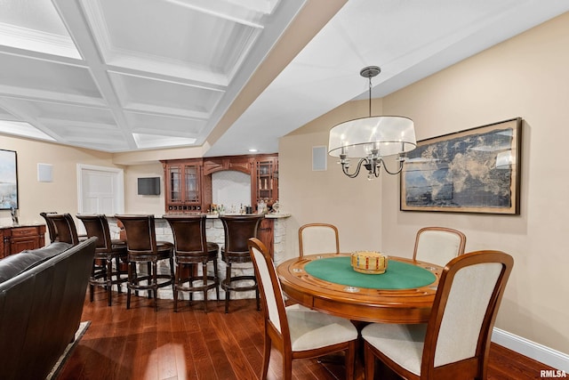 dining area featuring baseboards, coffered ceiling, a notable chandelier, dark wood-type flooring, and visible vents