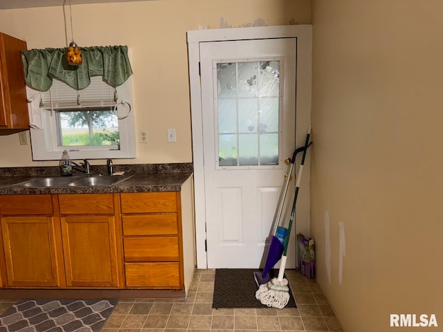 kitchen with sink and pendant lighting