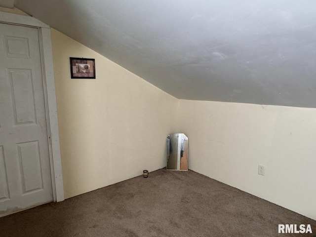 bonus room featuring carpet flooring and vaulted ceiling