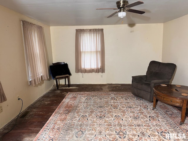 living area with ceiling fan