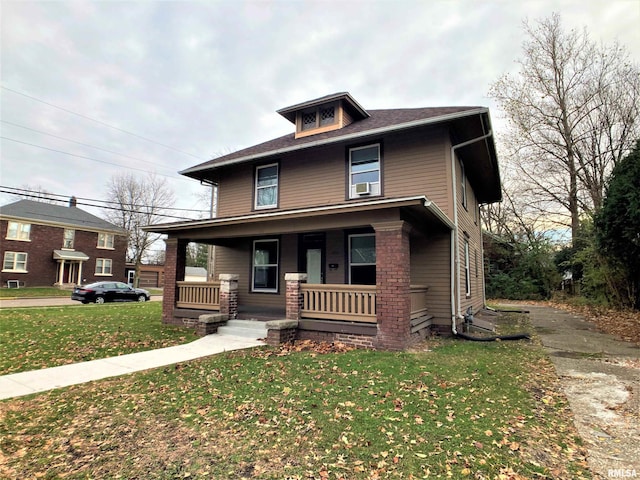 view of front of home featuring a porch, a front lawn, and cooling unit