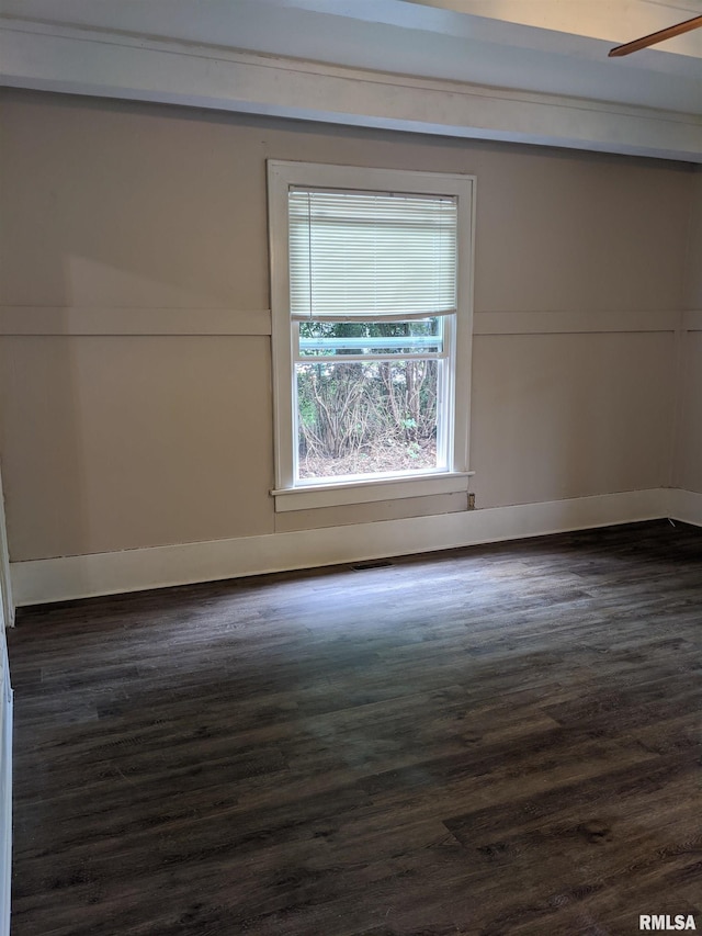 spare room featuring dark hardwood / wood-style floors and ceiling fan