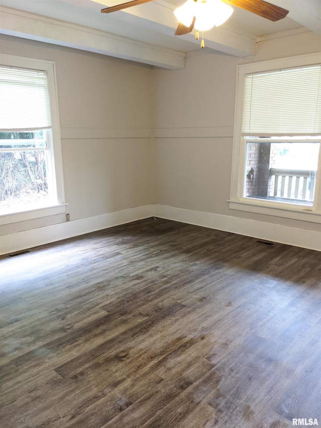 spare room featuring beamed ceiling, ceiling fan, and dark hardwood / wood-style floors