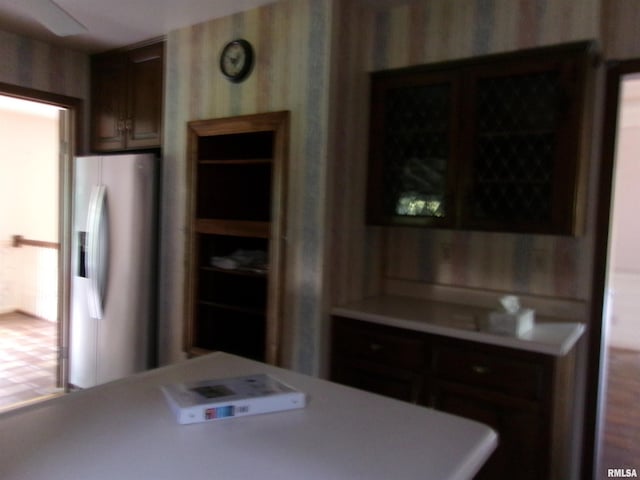 kitchen featuring stainless steel refrigerator with ice dispenser