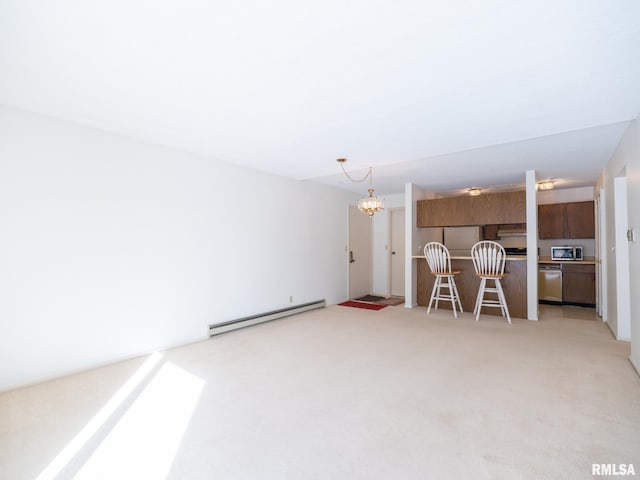 unfurnished living room featuring light carpet, a notable chandelier, and baseboard heating