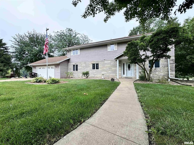 traditional-style home featuring stone siding, a front yard, and a garage