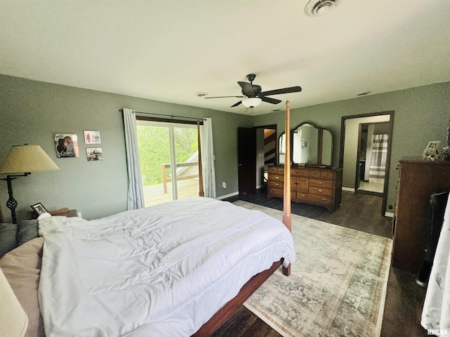 bedroom with a ceiling fan, wood finished floors, visible vents, baseboards, and access to outside