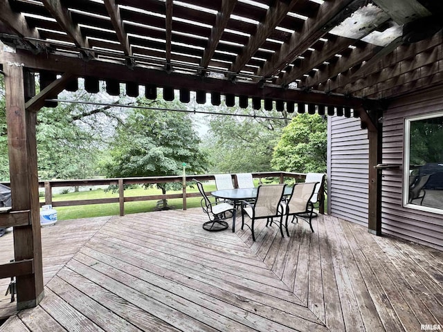 wooden deck featuring a pergola and outdoor dining area