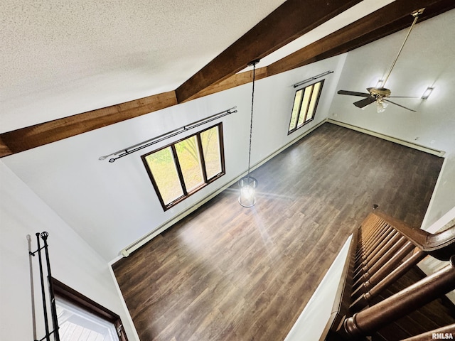 stairs featuring vaulted ceiling with beams, a textured ceiling, ceiling fan, and wood finished floors