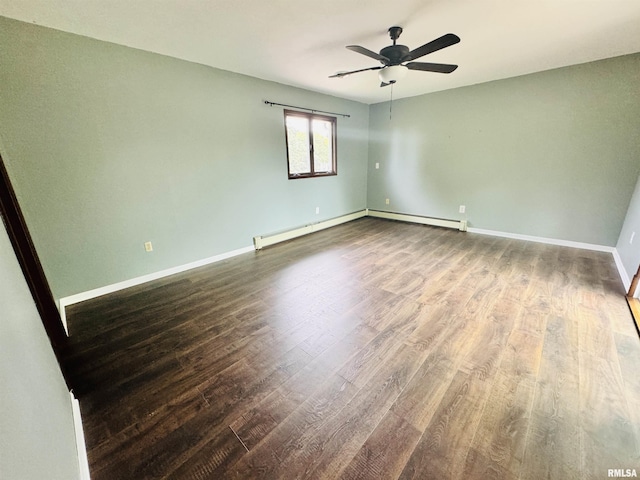 unfurnished room with ceiling fan, a baseboard heating unit, baseboards, and wood finished floors