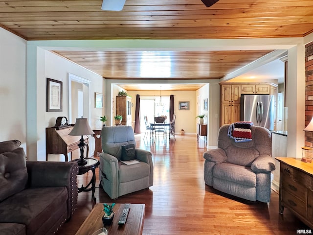 living room featuring light hardwood / wood-style floors and wooden ceiling