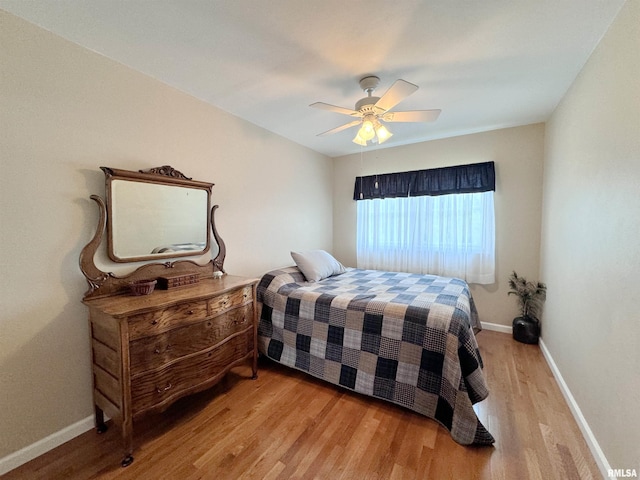 bedroom featuring light wood-type flooring and ceiling fan