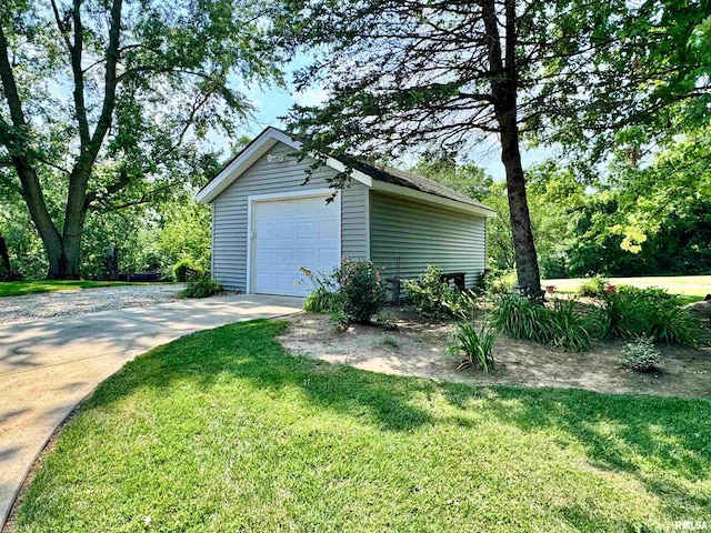 garage featuring a yard