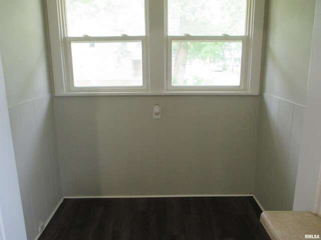 empty room with dark wood-type flooring