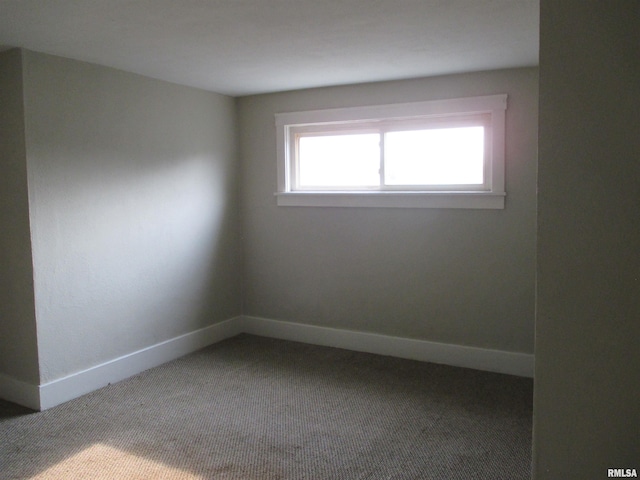 empty room featuring carpet flooring